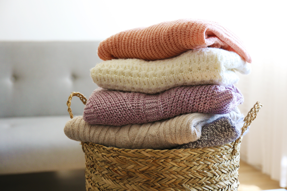 Bunch,Of,Stacked,Knitted,Pastel,Color,Sweaters,With,Different,Knitting