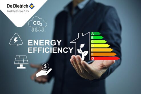 Businessman holding home's energy efficiency rating label, which